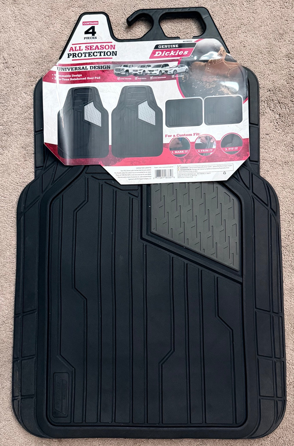 Actual Dickies 80338WDI four-piece all-season trim-to-fit floor mat set in its retail packaging, photographed by the seller.