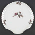 Japan 31-10A pink moss rose shell-shaped plate catalog pattern reference; actual plate in its wrapping is shown second. Diameter is unmeasured.